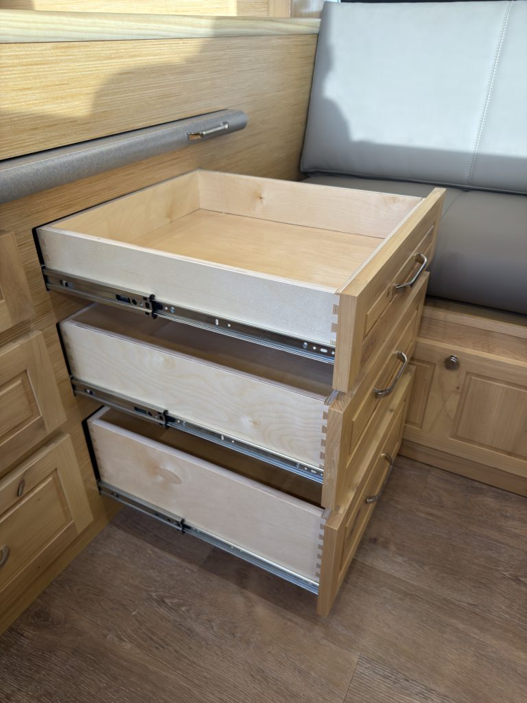 Van Niewkoop Camp #136: Three bed drawers extended beside the upholstered side bench.